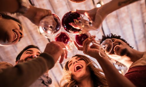 Low angle view of happy start up team toasting to their success.